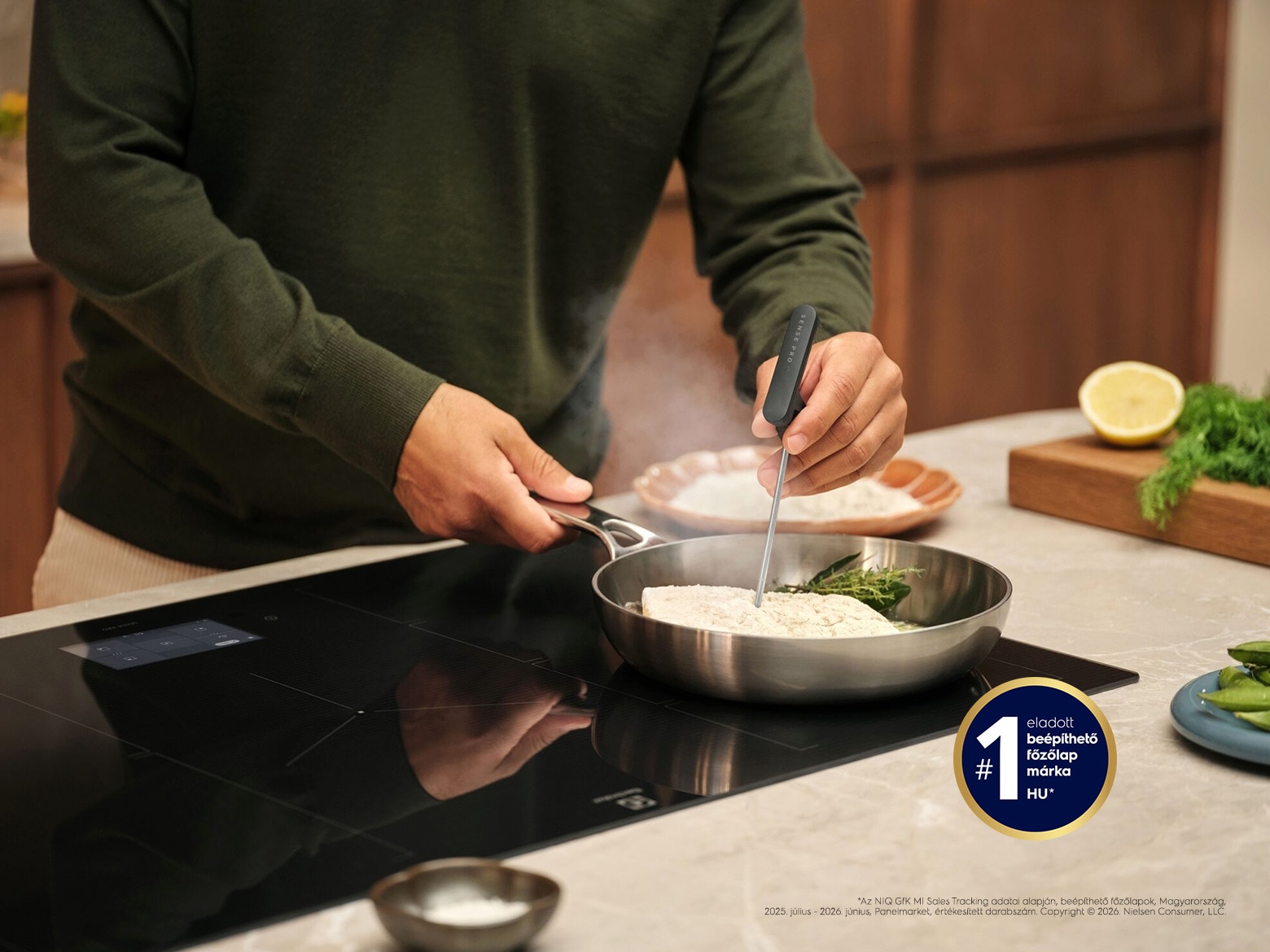 Food is being prepared on an induction hob.
