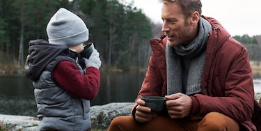 father and son having a picnic