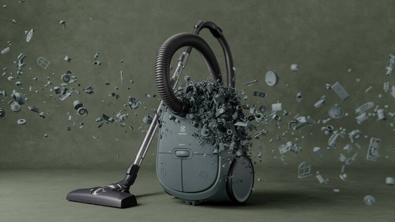 A green Electrolux vacuum cleaner made with 50% recycled plastics