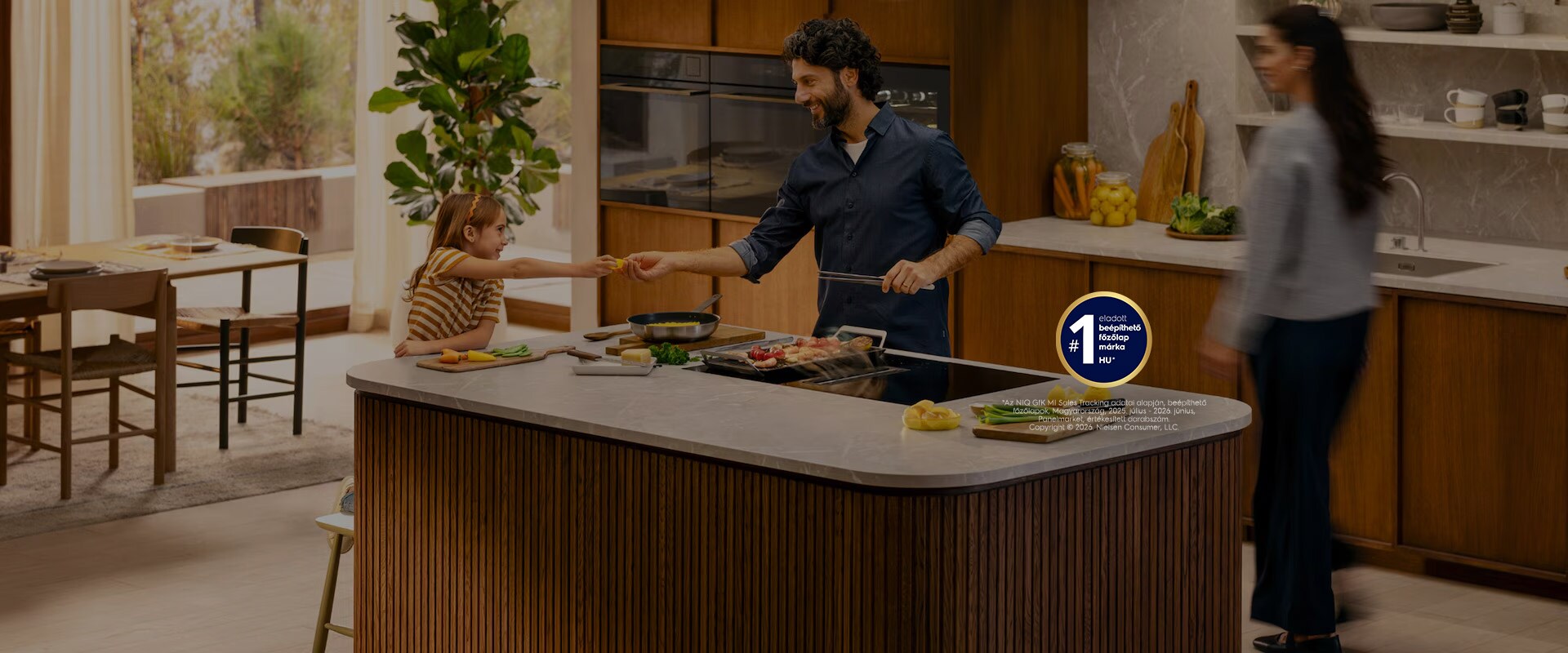 A family is cooking dinner together in a modern kitchen.