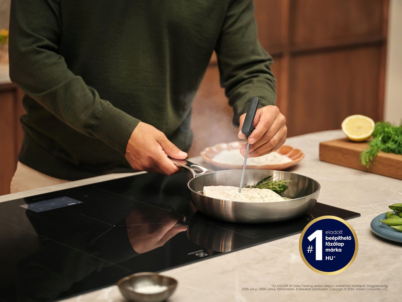 Food is being prepared on an induction hob.